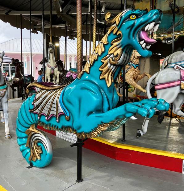 A blue dragon on a merry go round
AI-generated content may be incorrect.