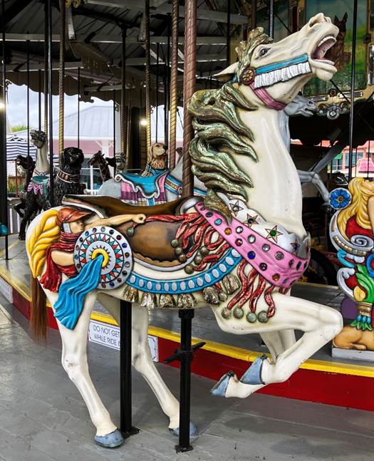 A carousel horse with colorful decorations

AI-generated content may be incorrect.
