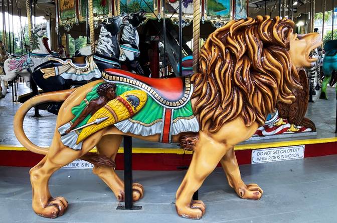 A lion on a carousel
AI-generated content may be incorrect.