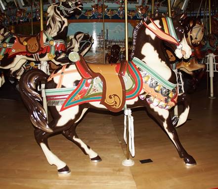 A picture containing floor, indoor, carousel, decorated

Description automatically generated