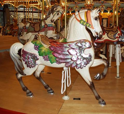 A picture containing floor, indoor, carousel, ride
Description automatically generated