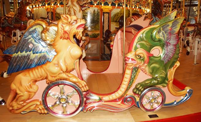 A picture containing indoor, carousel, ride, decorated

Description automatically generated