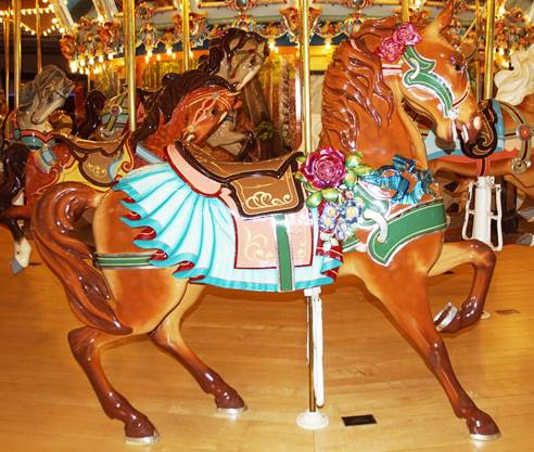 A picture containing carousel, floor, ride, outdoor object

Description automatically generated