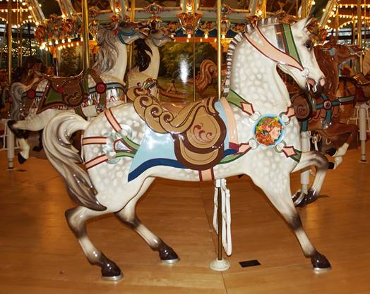 A picture containing carousel, floor, ride, indoor

Description automatically generated