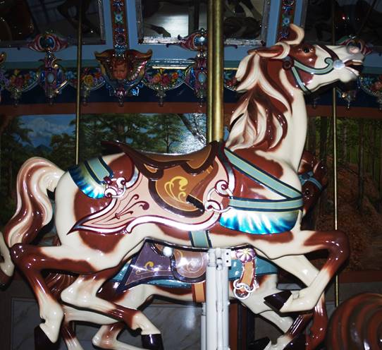 A picture containing indoor, carousel, ride, decorated

Description automatically generated