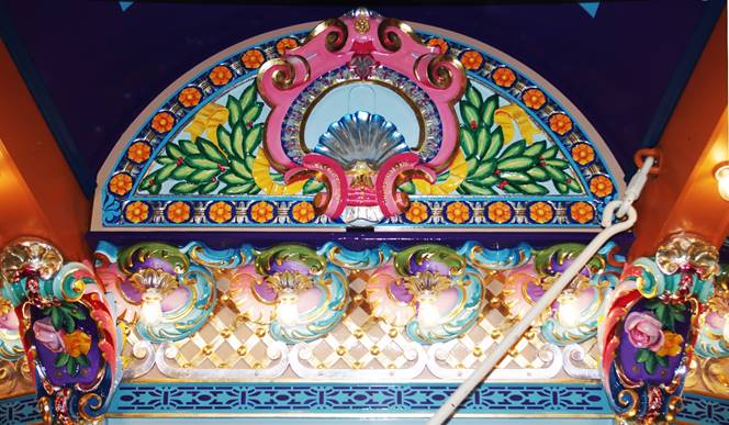 A picture containing text, window, decorated
Description automatically generated