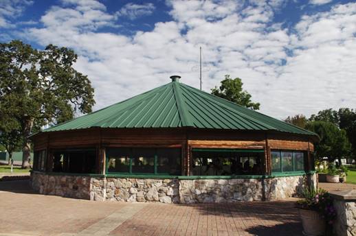 A house with trees in the background
Description automatically generated