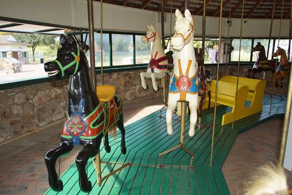 A picture containing indoor, floor, wall, table
Description generated with very high confidence