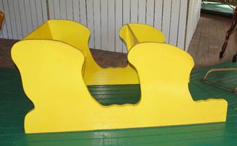 A yellow chair

Description generated with high confidence