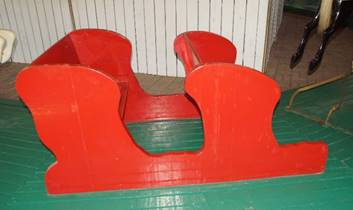 A close up of a red chair

Description generated with high confidence