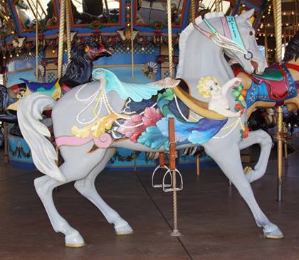 A picture containing carousel, floor, ride, indoor
Description generated with very high confidence