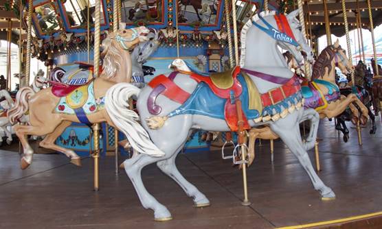 A picture containing carousel, outdoor object, ride, floor
Description generated with very high confidence