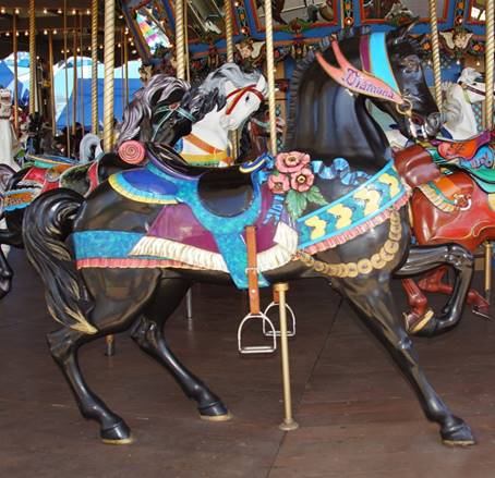A picture containing carousel, floor, ride, indoor
Description generated with very high confidence
