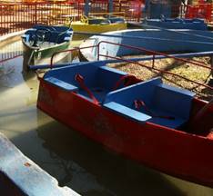 A small boat in a harbor

Description generated with high confidence