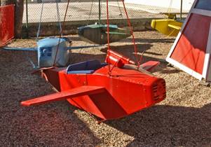 A picture containing red, ground, building, outdoor
Description generated with very high confidence