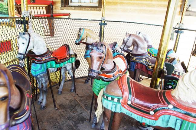 A picture containing indoor, carousel, ride

Description automatically generated