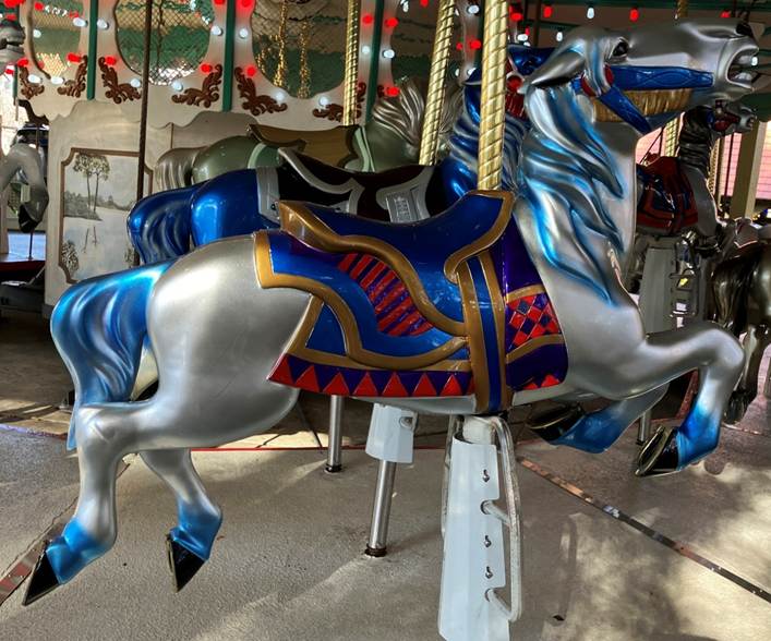 A carousel horse with blue and silver horses

AI-generated content may be incorrect.