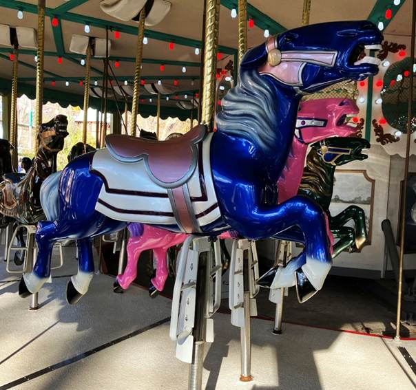 A carousel with horses on it
AI-generated content may be incorrect.
