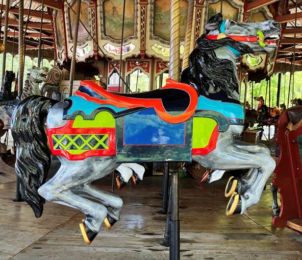 A carousel with horses on it
AI-generated content may be incorrect.