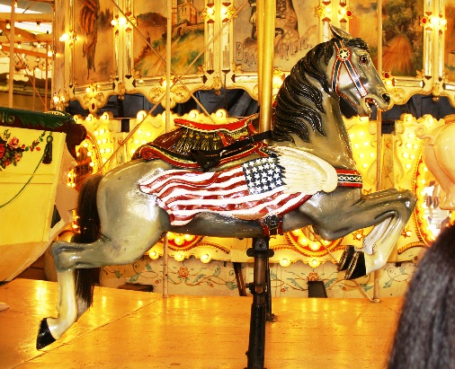 A horse on a merry go round

Description automatically generated