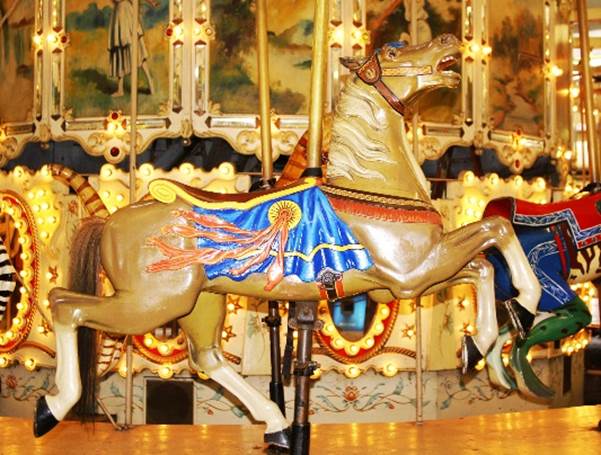 A horse on a merry go round

Description automatically generated