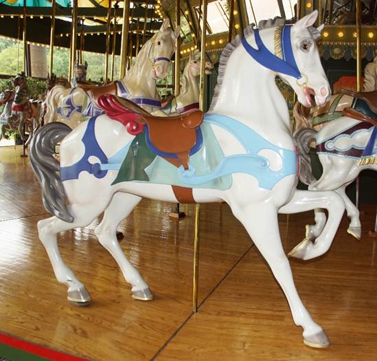 A picture containing carousel, outdoor object, ride, floor
Description automatically generated