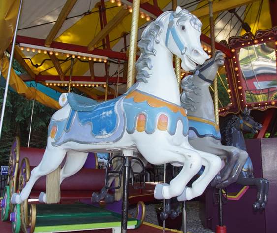 A picture containing floor, carousel, indoor, dog

Description automatically generated