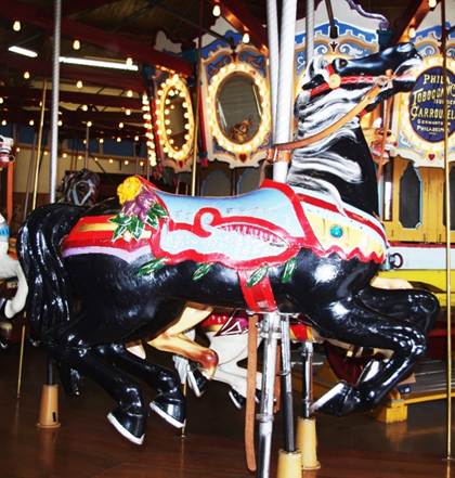 A picture containing carousel, ride, floor, indoor

Description automatically generated