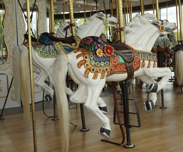 A chair sitting in front of a carousel

Description automatically generated